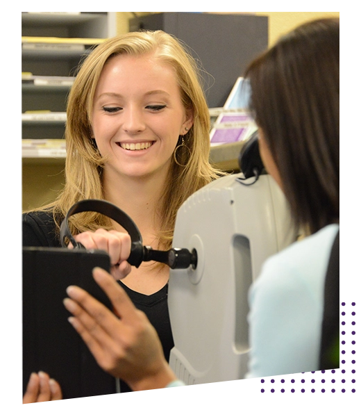 Smiling Female Patient In Physical Therapy Machine